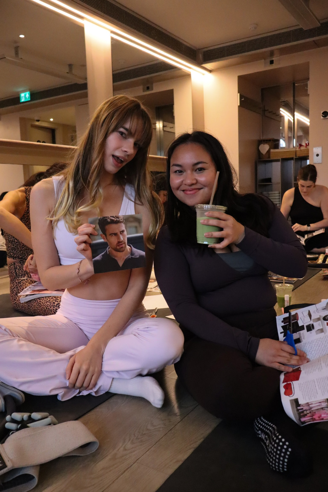 Members with smoothies at a vision board session
